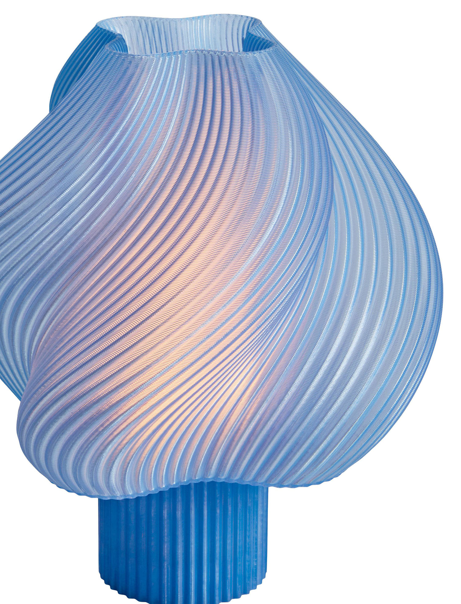 A blue glass lamp with wavy waves.