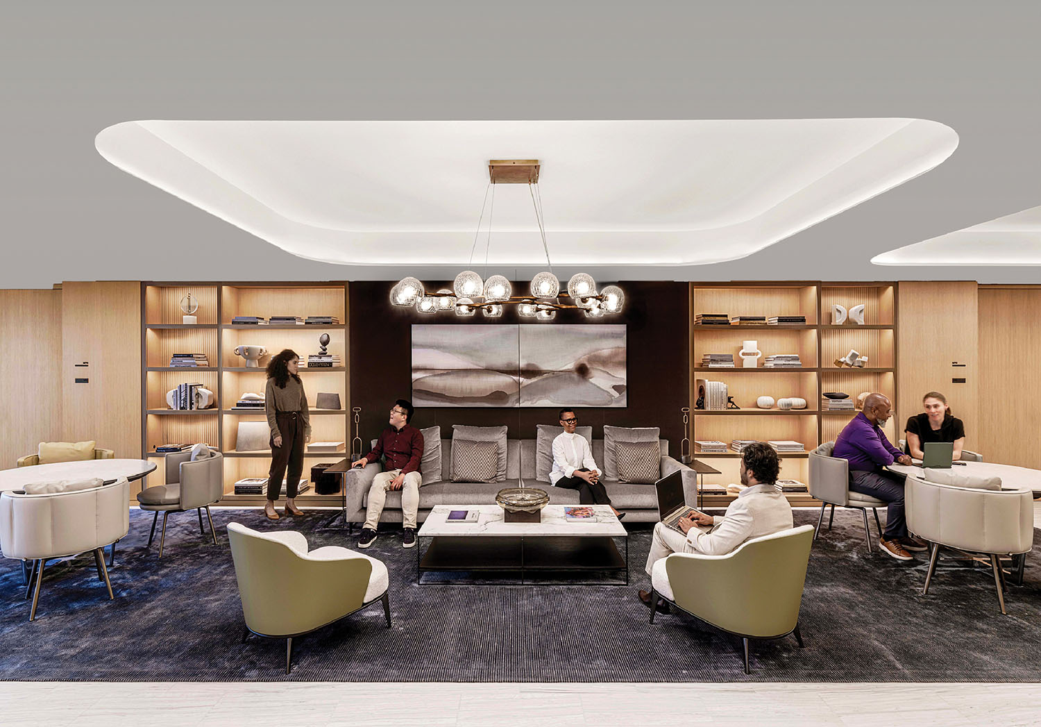 A group of people sitting in a living room.