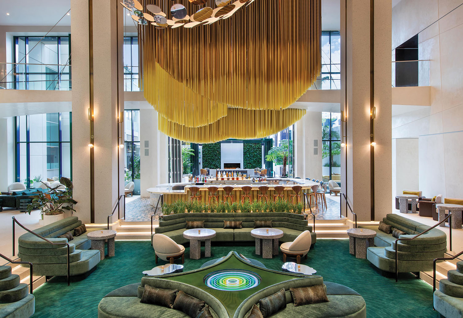 A living room with a large green rug