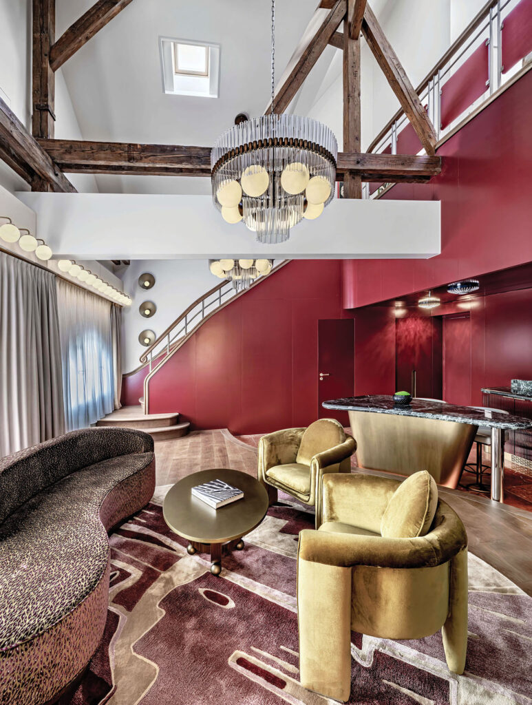 A living room with a couch, chair, and a table.