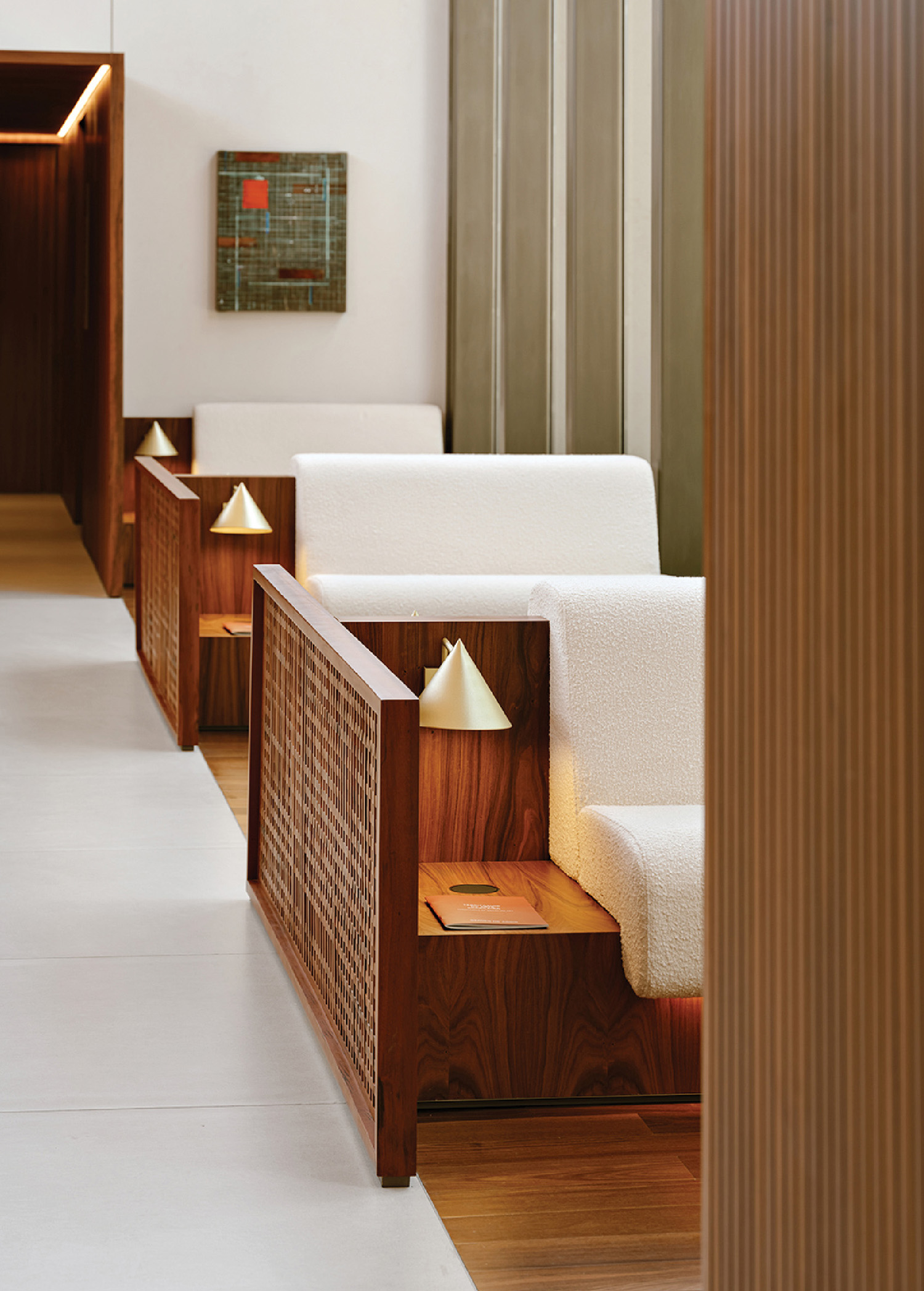 A long row of white couches in a room