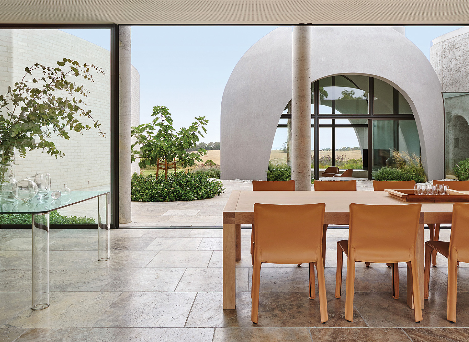 A dining table and chairs in a room