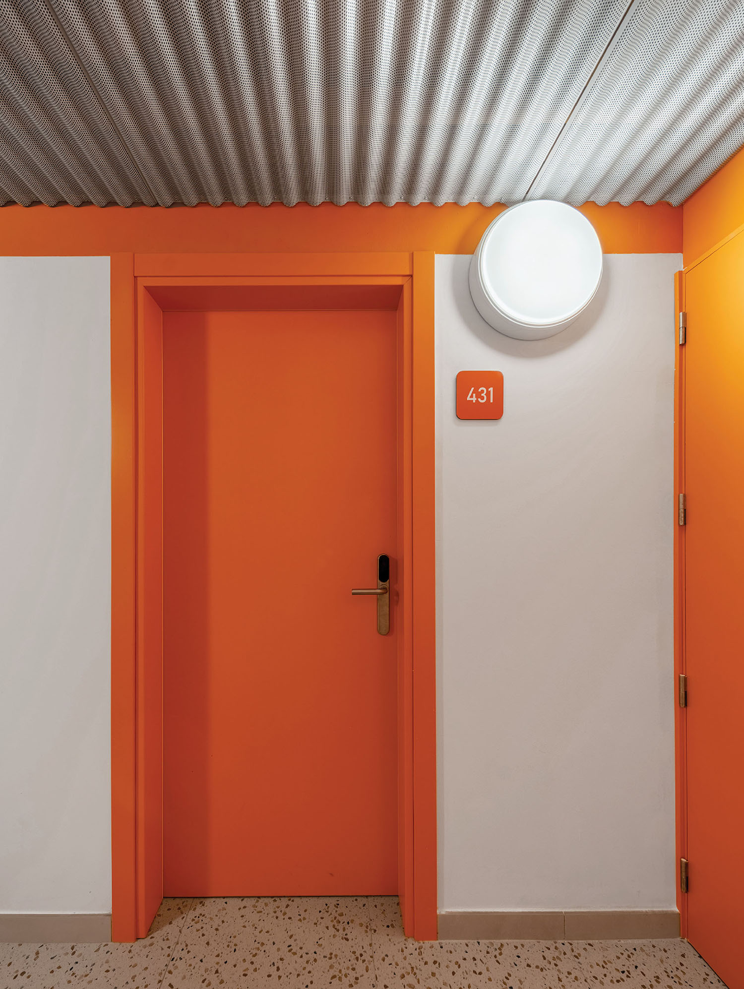 a room with two doors and a light