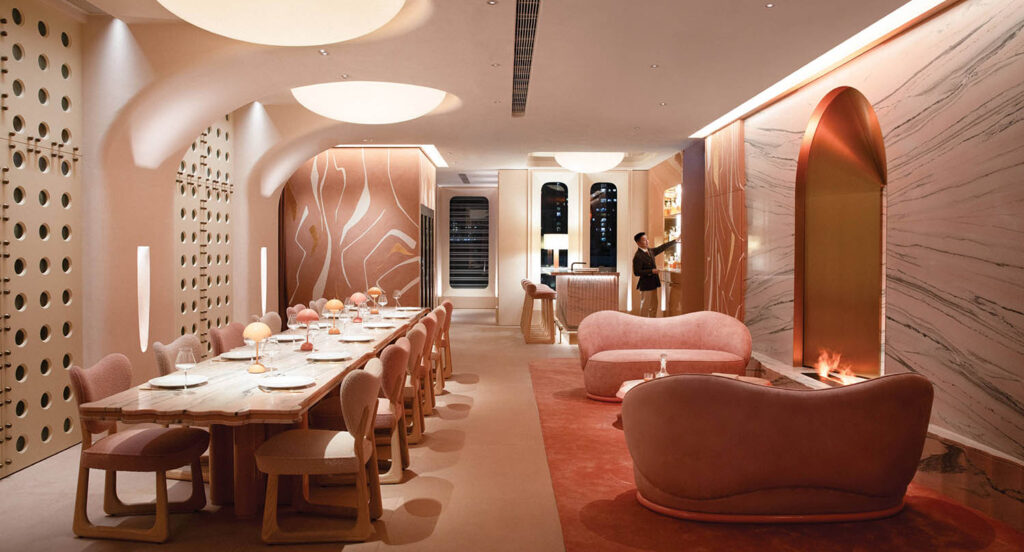 A dining room with a table and chairs.