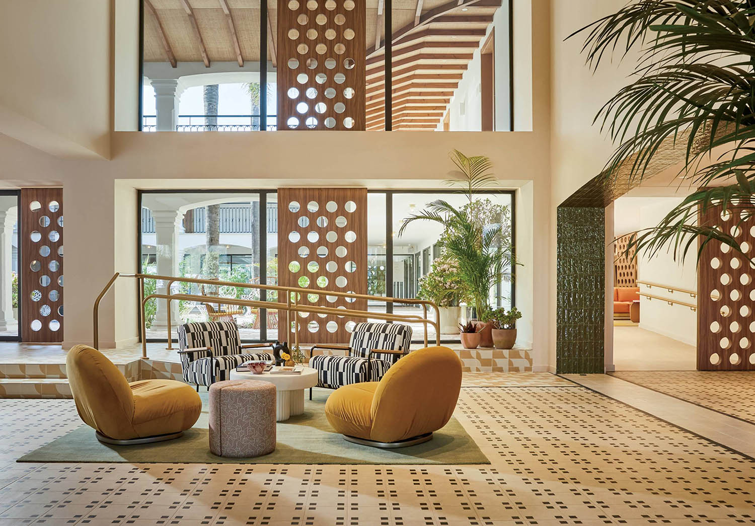 A large room with a large plant in the center.