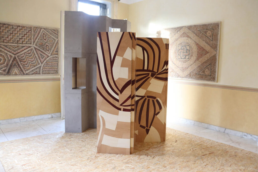 a wood screen with tan and black and white design