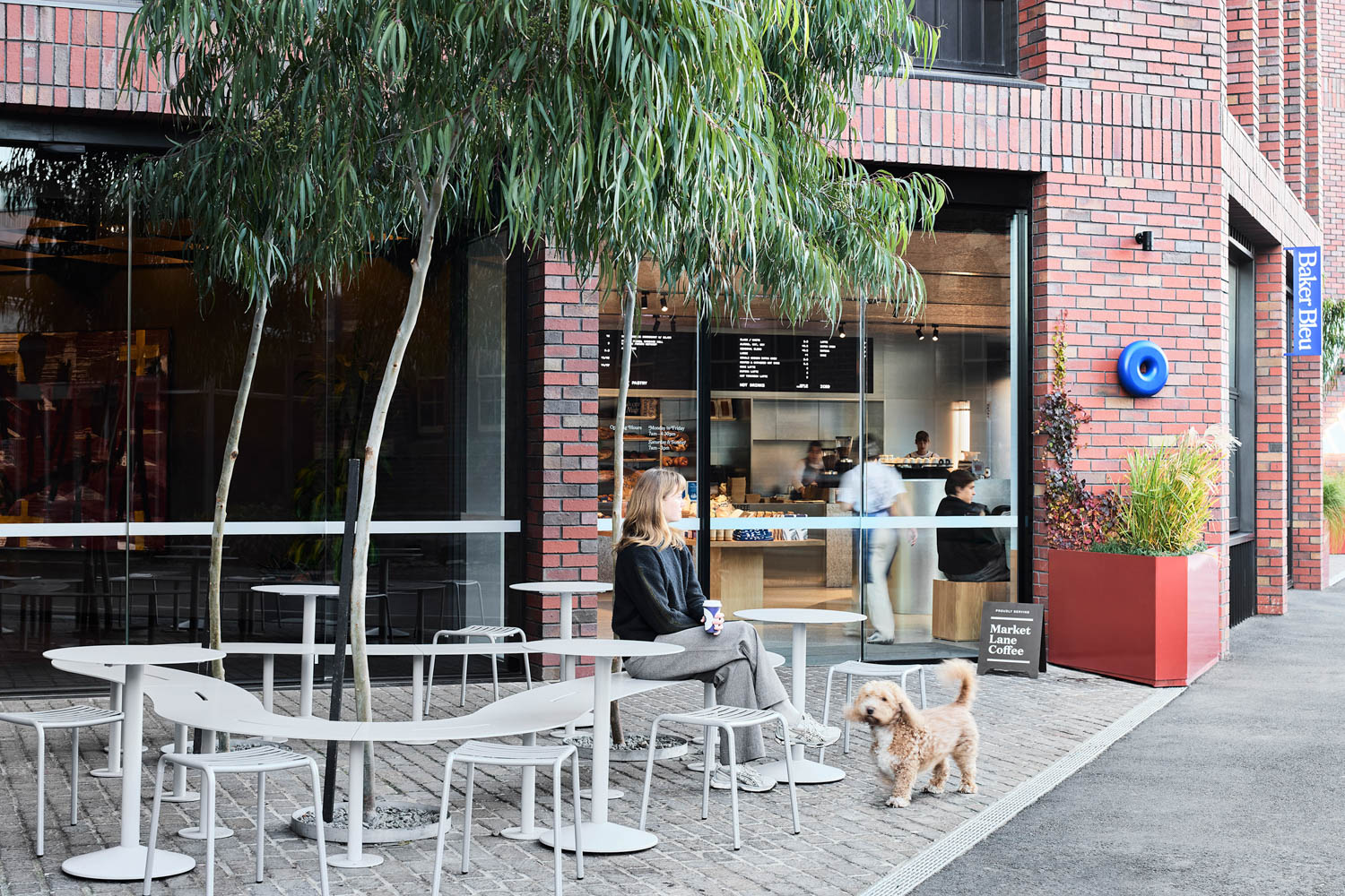 outdoor seating with a woman and dog