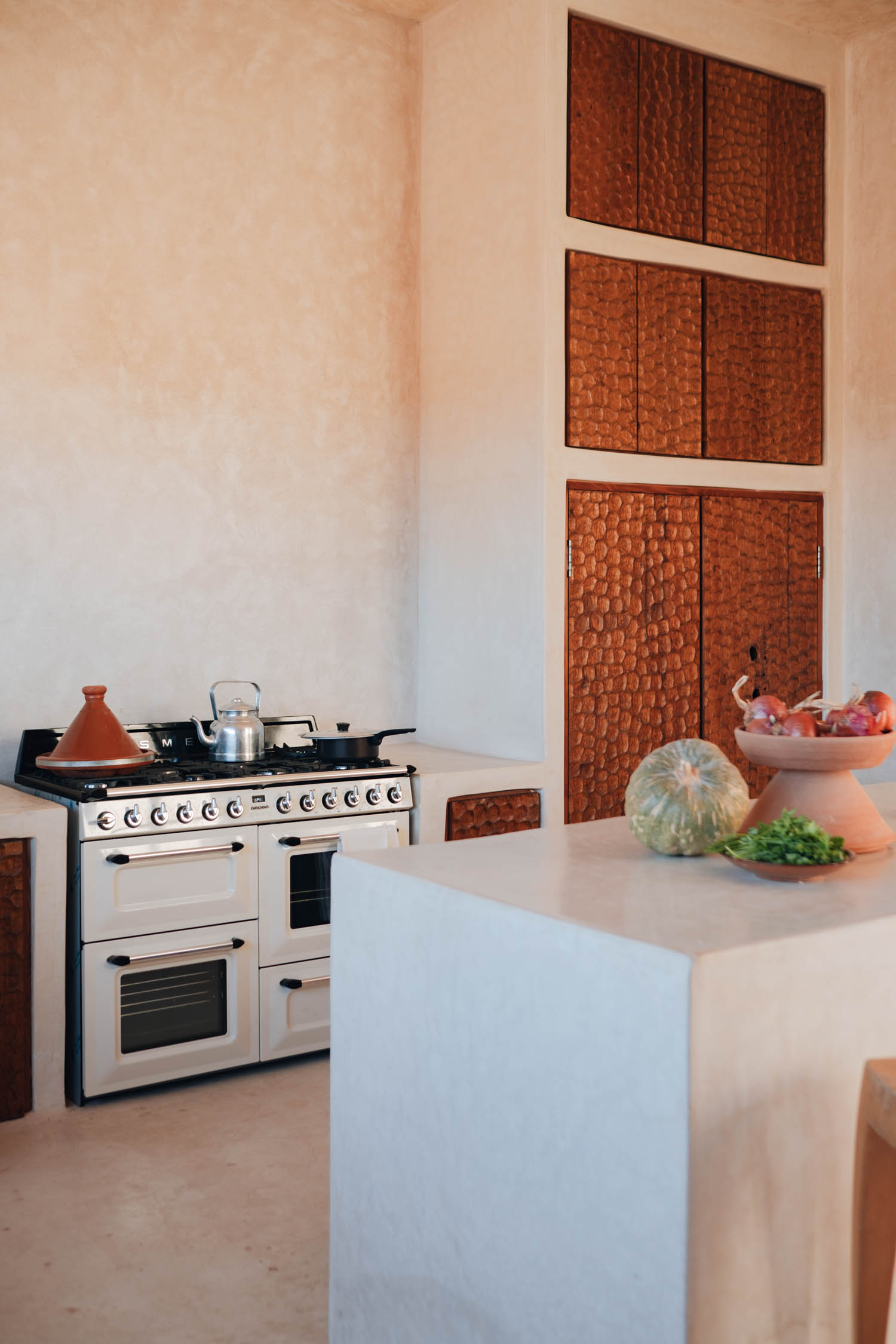 kitchen area with white island and stove